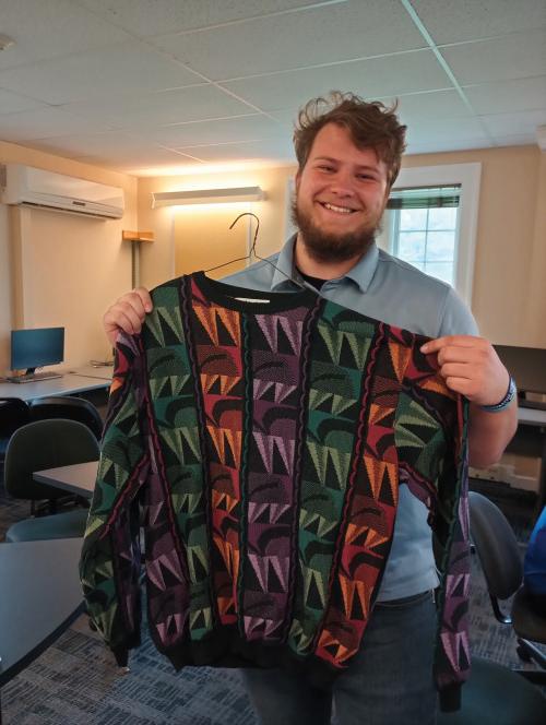 Trevor Cain'24 with one of Bob Elder's vintage patterned sweaters